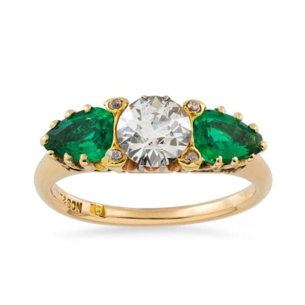 An Early 20th Century Three Stone Emerald And Diamond Ring