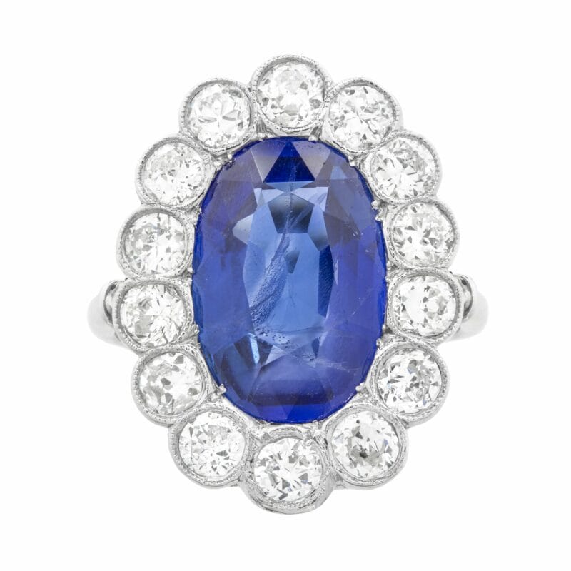 A Large Burma Sapphire And Diamond Cluster Ring