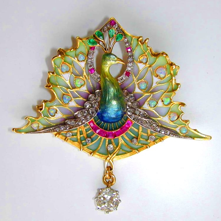 An Art Nouveau Enamel And Gemset Peacock Brooch