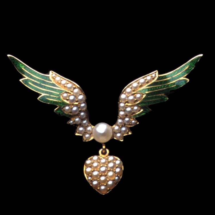 A Victorian Pearl And Enamel Heart And Wing Brooch