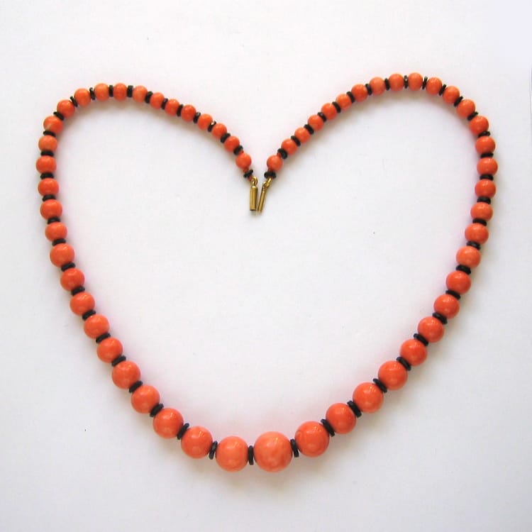 A Coral And Onyx Bead Necklace And Earrings
