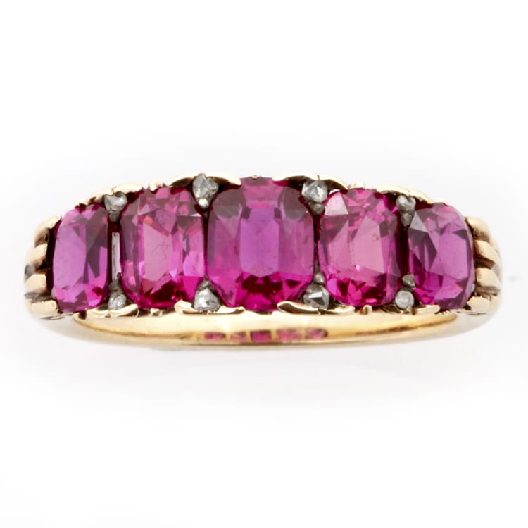 A Late Victorian Five Stone Ruby Carved Half Hoop Ring