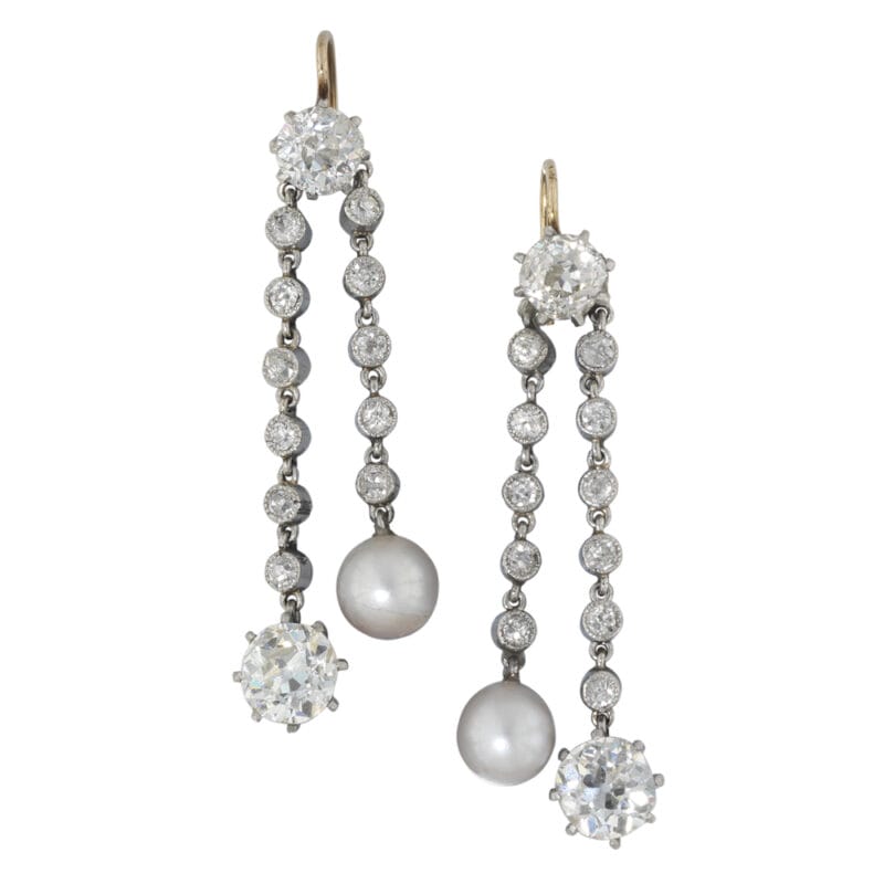 A pair of Edwardian natural pearl and diamond drop earrings