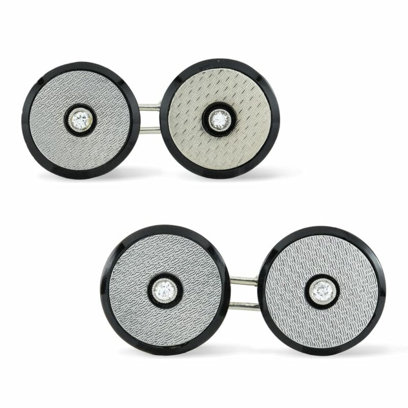 A Pair Of White Gold, Onyx And Diamond Cufflinks