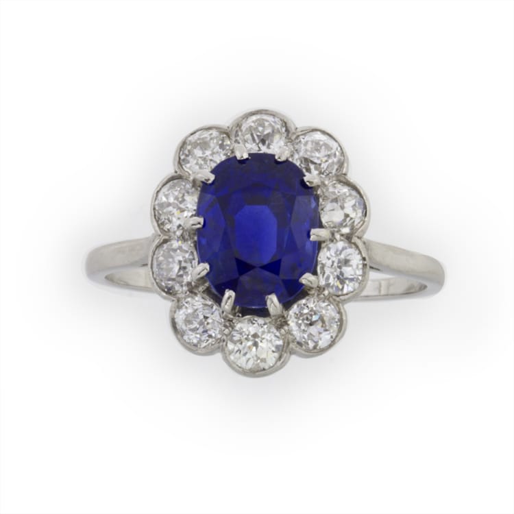 An Oval Sapphire And Diamond Cluster Ring