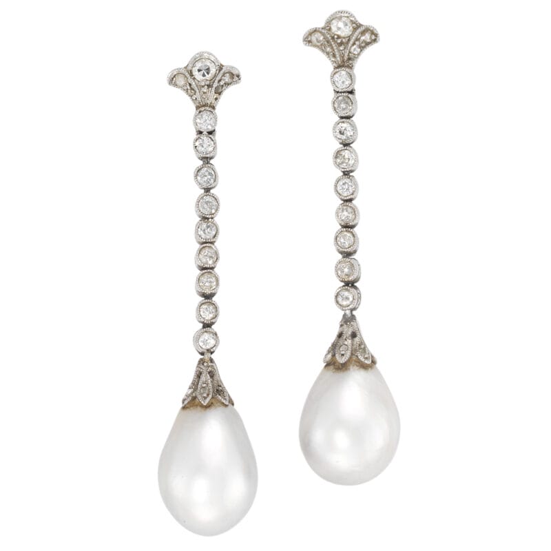 A pair of Edwardian natural pearl and diamond earrings