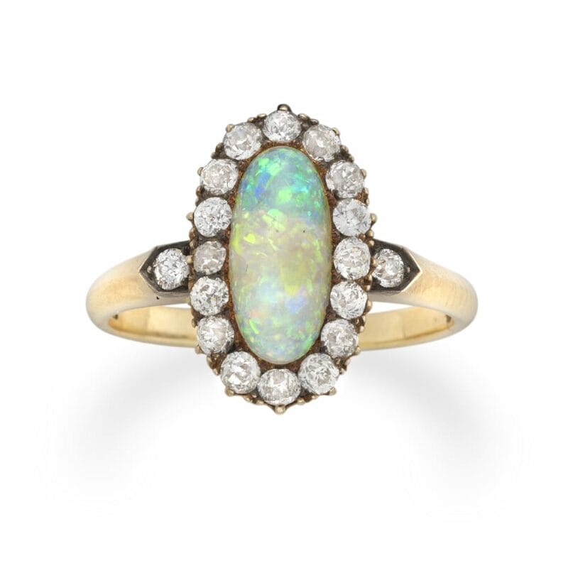 An Oval Opal And Diamond Cluster Ring
