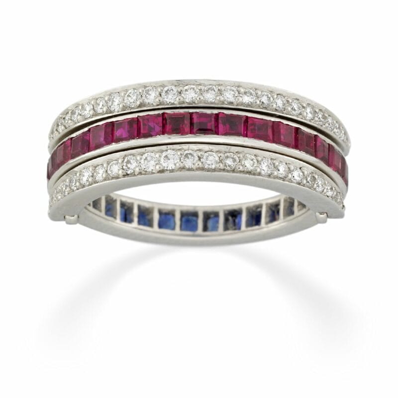 A Sapphire, Ruby And Diamond Swivel Ring