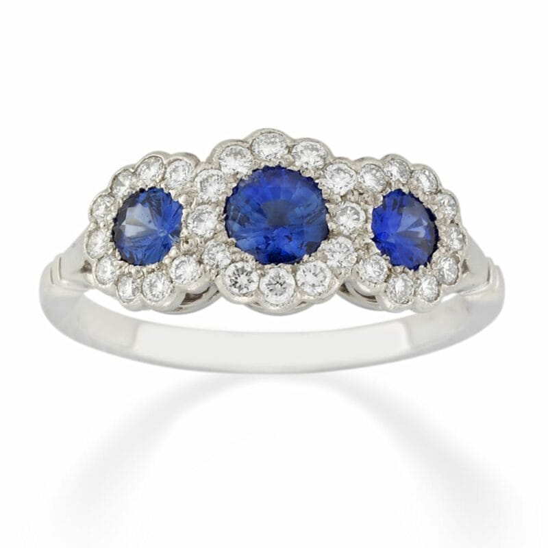 A Triple Cluster Sapphire And Diamond Ring