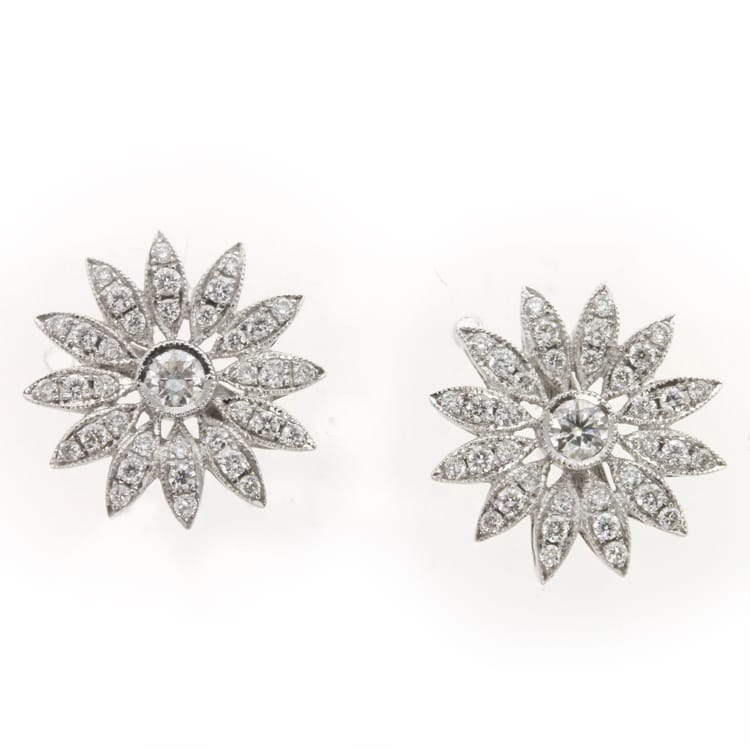 A Pair Of Diamond Flower Head Earrings