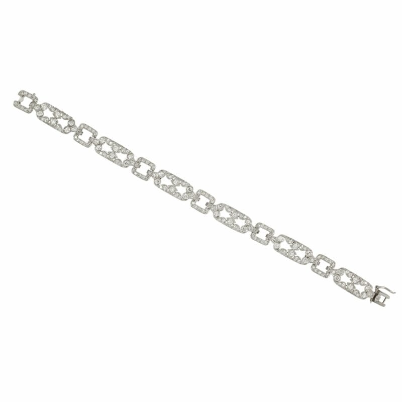 An Art Deco Scroll Link Diamond Set Bracelet