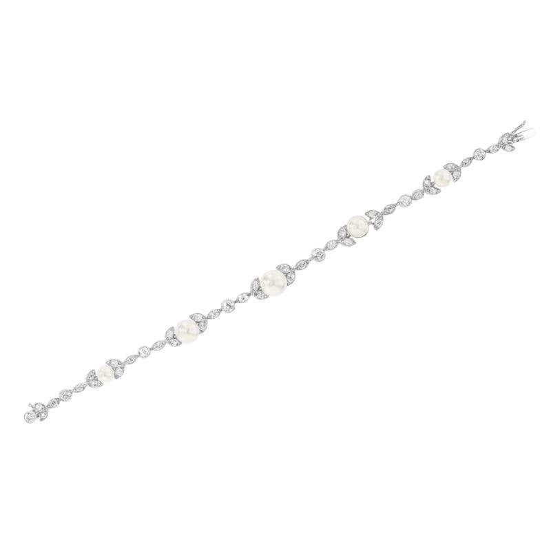 An Edwardian Natural Pearl And Diamond Foliate Link Bracelet
