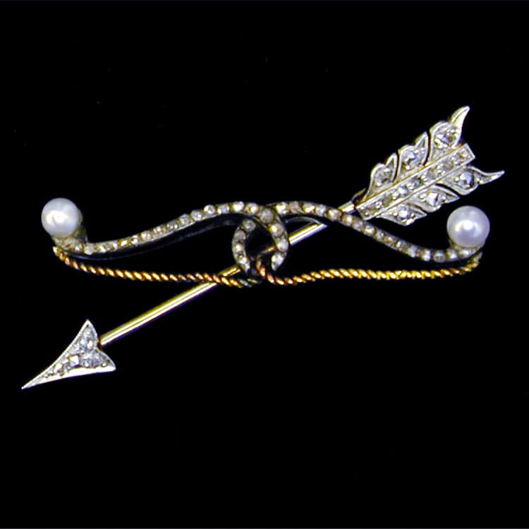 An Antique Diamond Set Arrow And Bow Brooch