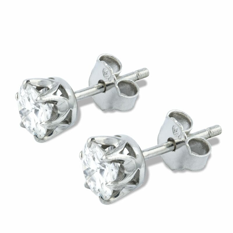 A Pair Of Single Stone Diamond Stud Earrings