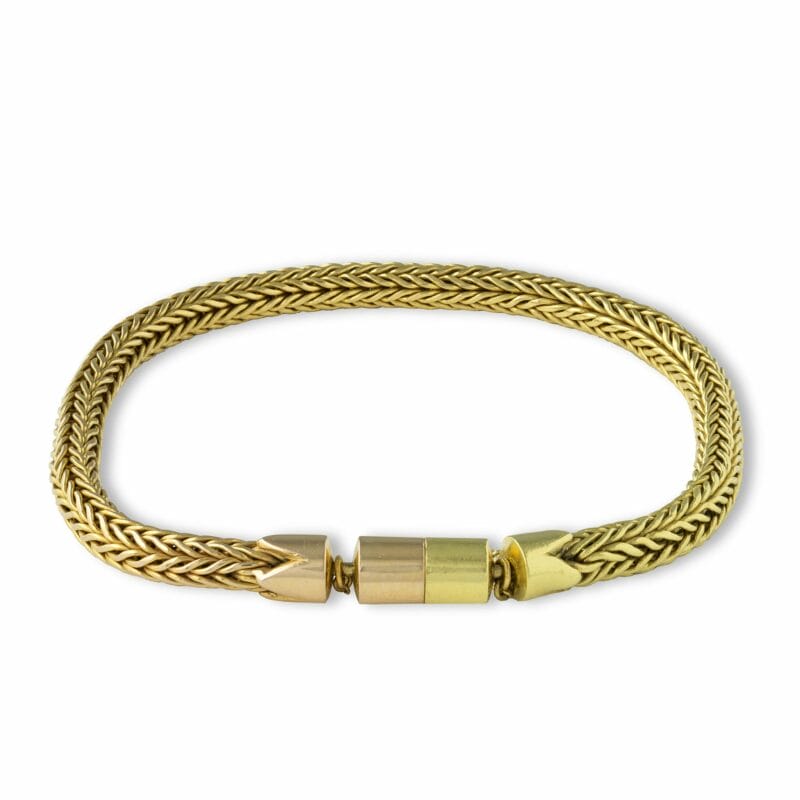 A Handwoven Gold Bracelet By Lucie Heskett-brem