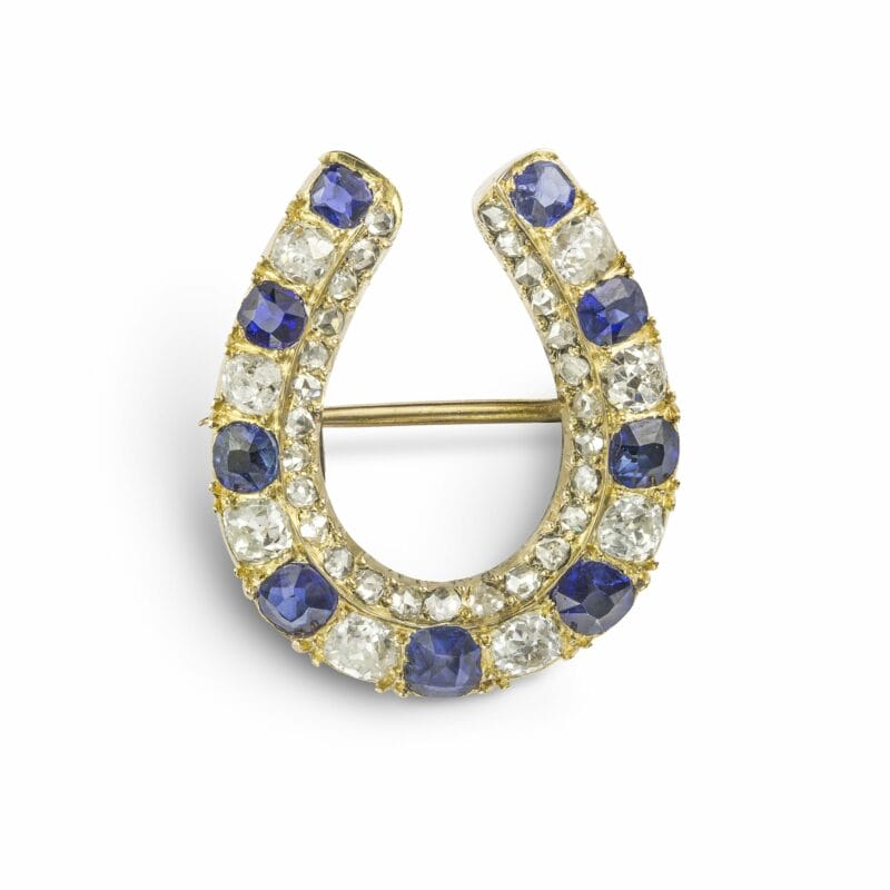A Sapphire And Diamond Horseshoe Brooch