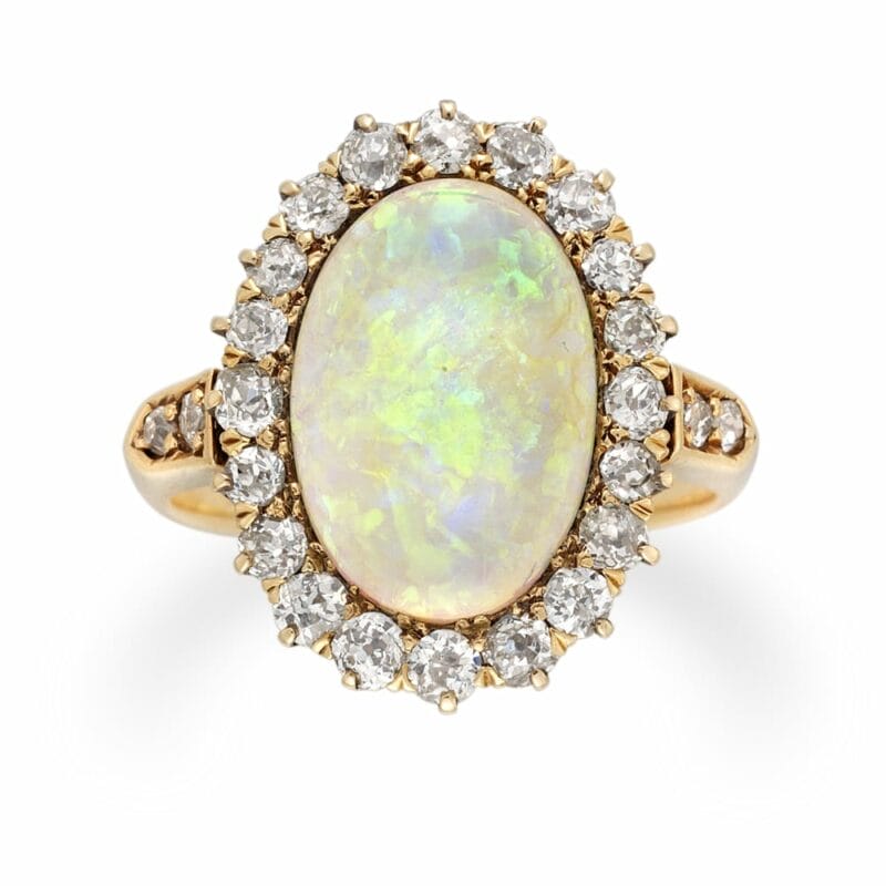 A Late Victorian Oval Opal And Diamond Cluster Ring