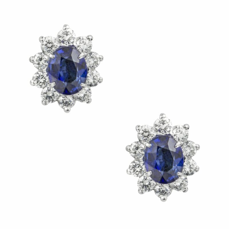 A Pair Of Oval Sapphire And Diamond Cluster Earrings