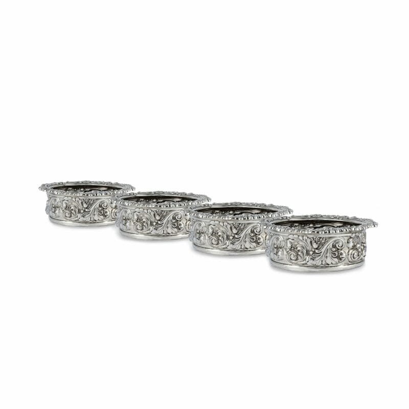 A Set Of Four George III Sterling Silver Wine Coasters