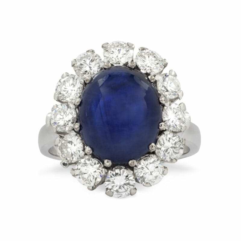 A Cabochon Sapphire And Diamond Cluster Ring