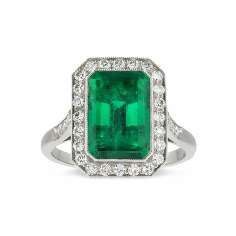 A Rectangular Emerald And Diamond Cluster Ring
