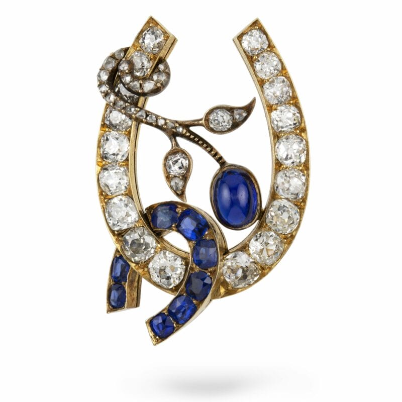 A Russian Sapphire And Diamond Horse-shoe Brooch