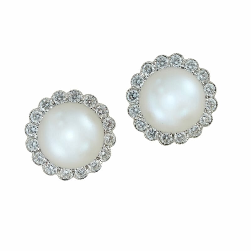 A Pair Of Cultured Pearl And Diamond Cluster Stud Earrings