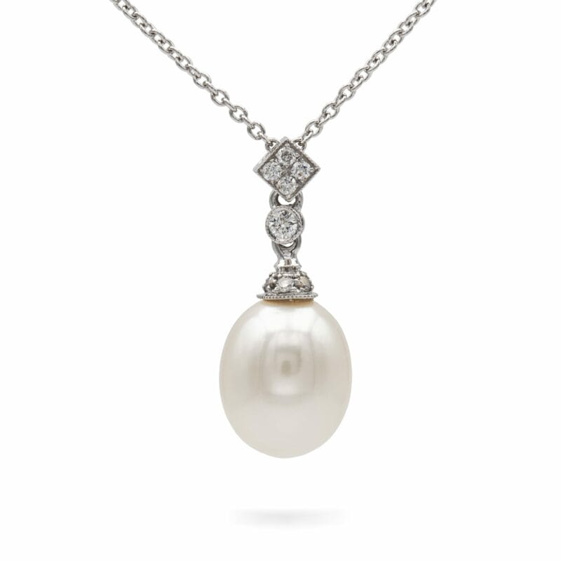 A Pearl And Diamond Pendant/necklace