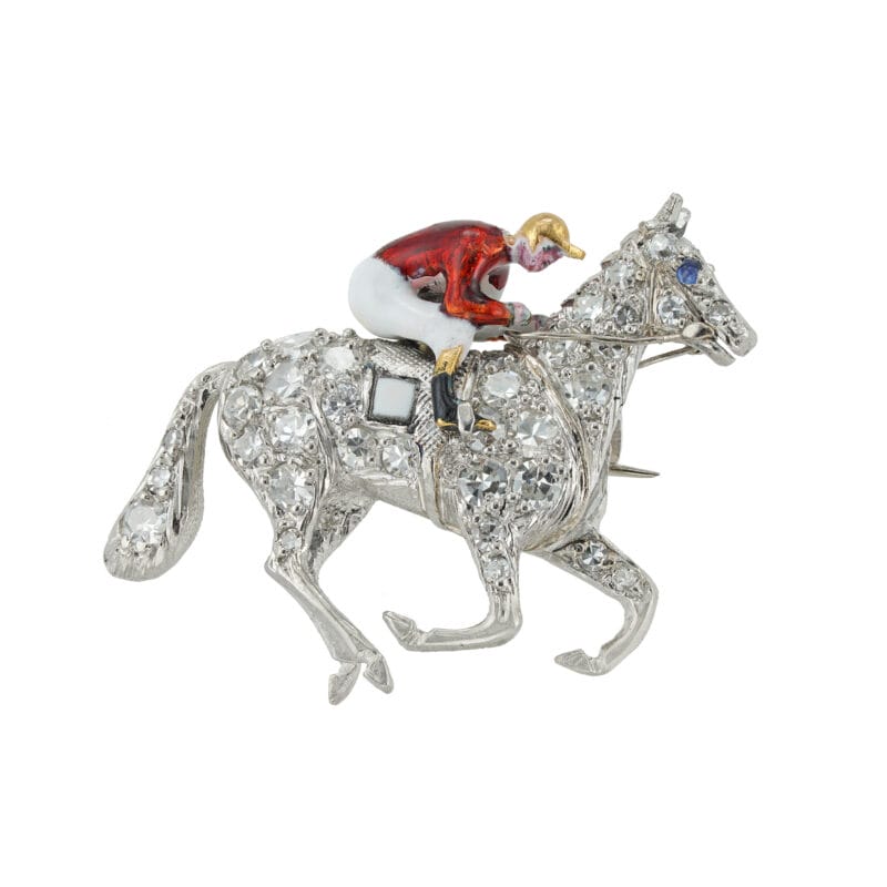 A late-Victorian diamond and enamel horse and jockey brooch