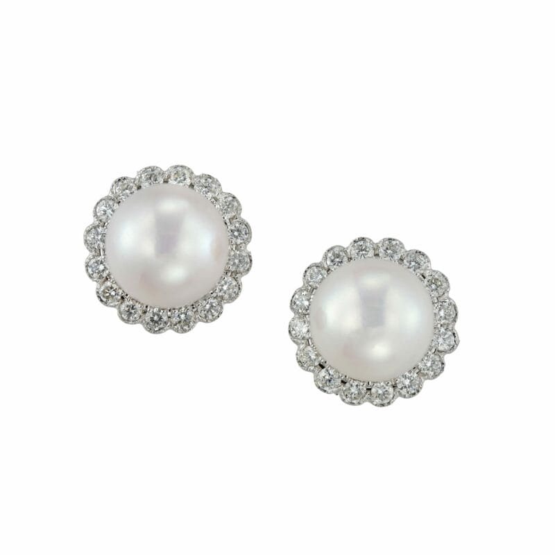 A pair of cultured pearl and diamond cluster earrings