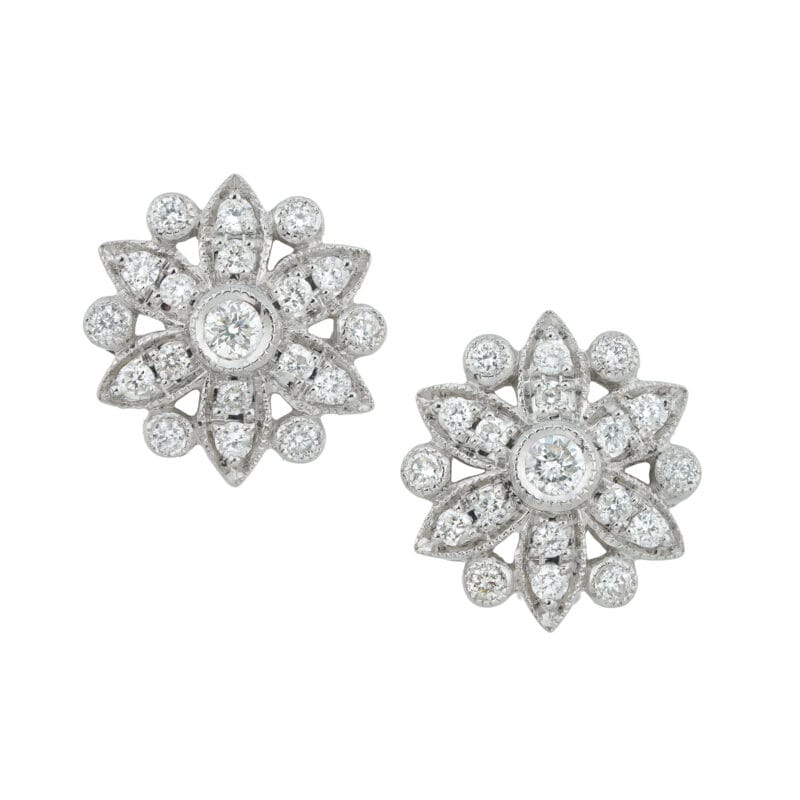 A pair of snowflake diamond cluster earrings