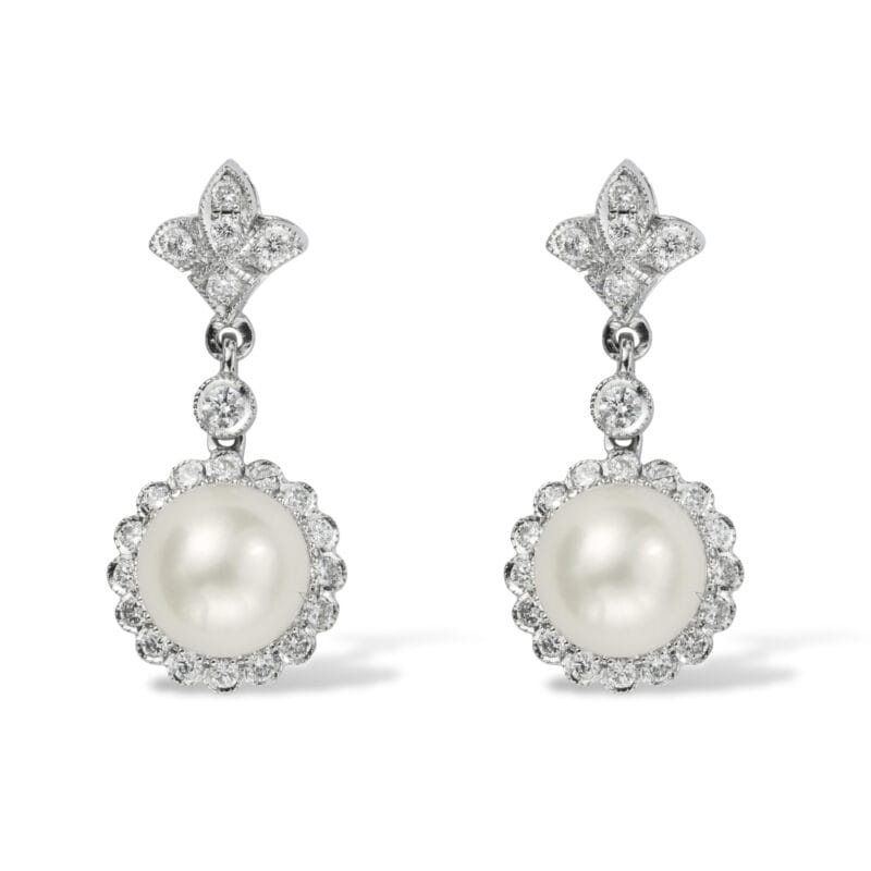 A pair of pearl and diamond cluster drop earrings