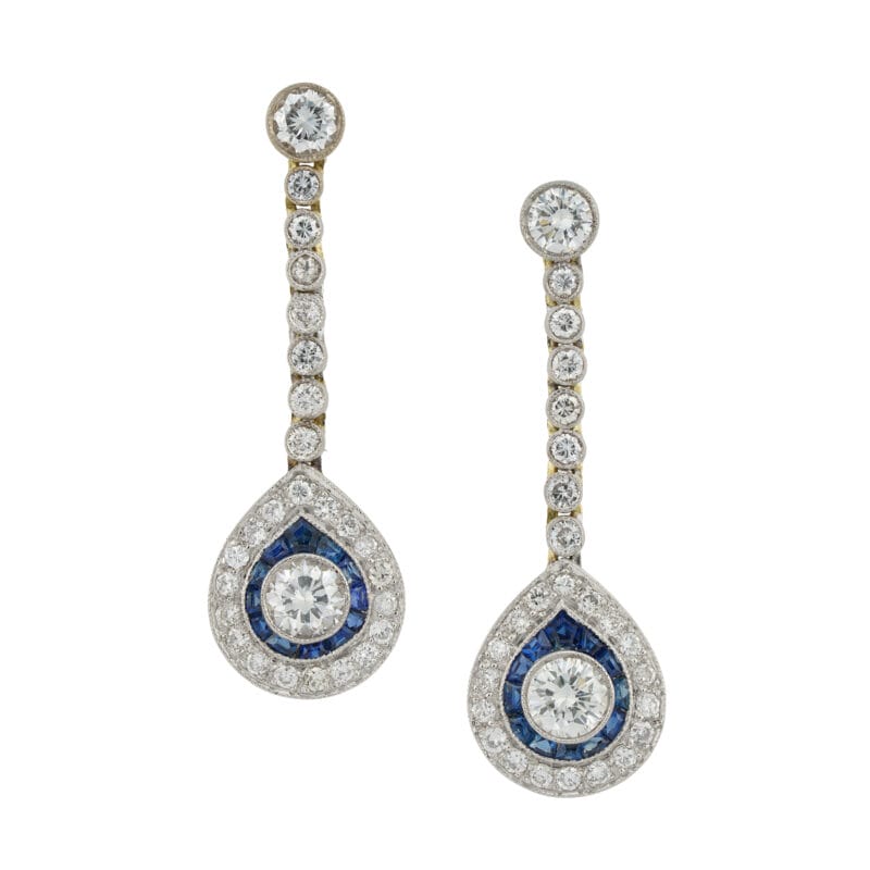 A pair of diamond and sapphire drop earrings