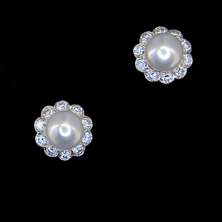 A Pair Of Cultured Pearl And Diamond Cluster Earrings