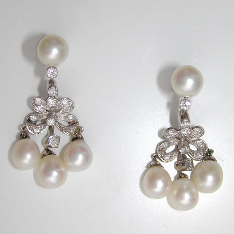 A Pair Of Cultured Pearl And Diamond Bow Drop Earrings