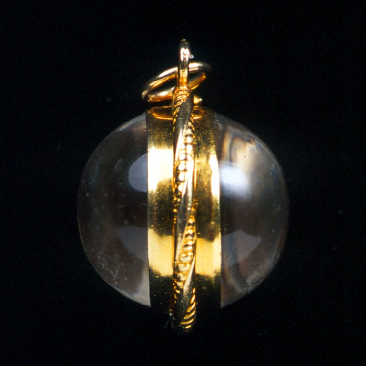 A Spherical Crystal Locket Pendant With Gold Border