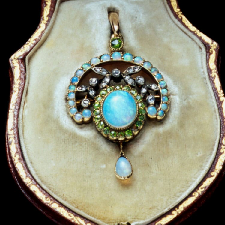 An Art Nouveau Opal, Demantoid Garnet And Diamond Pendant