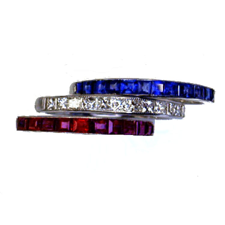 A Set Of Three Ruby Sapphire And Diamond Half Eternity Rings