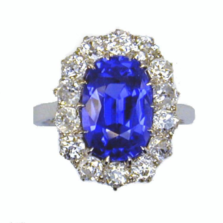 A Large Oval Sapphire And Diamond Cluster Ring