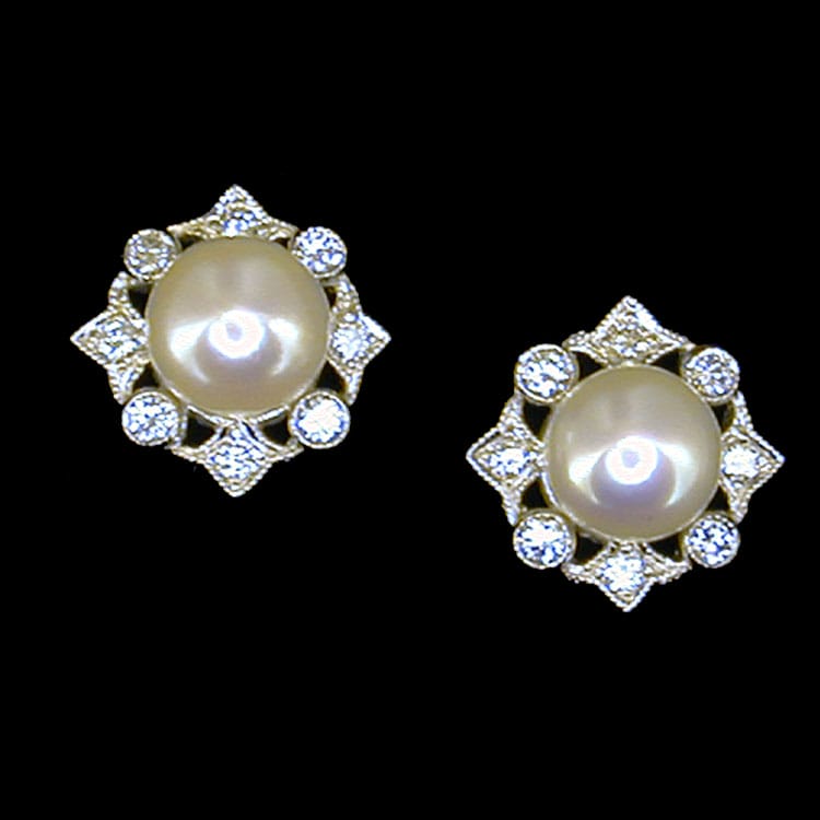 A Pair Of Cultured Pearl And Diamond Earrings