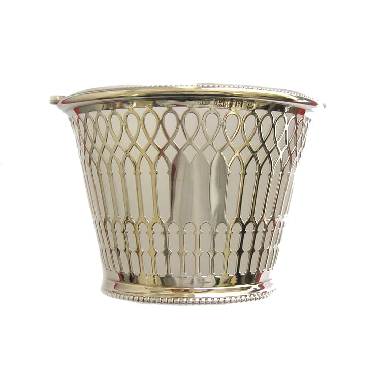 A Silver Pierced Ice Bucket With Frosted Glass Liner