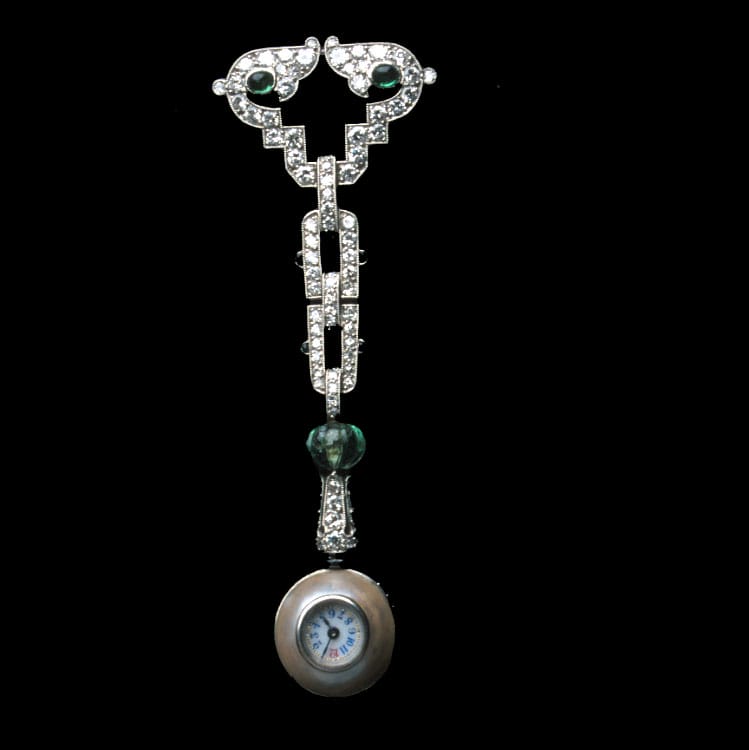 An Art Deco Diamond, Emerald And Pearl Pendant Watch