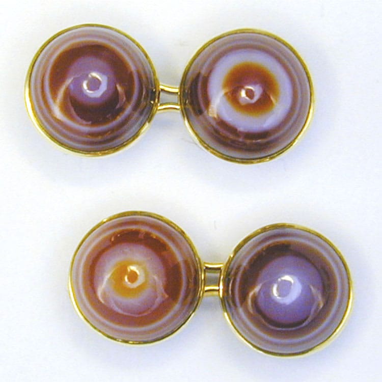 A Pair Of Cabochon Cut Banded Red Agate Cufflinks