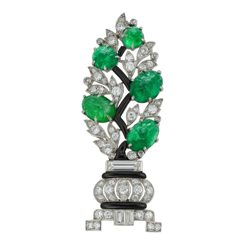 A French Art Deco Diamond And Carved Emerald Brooch
