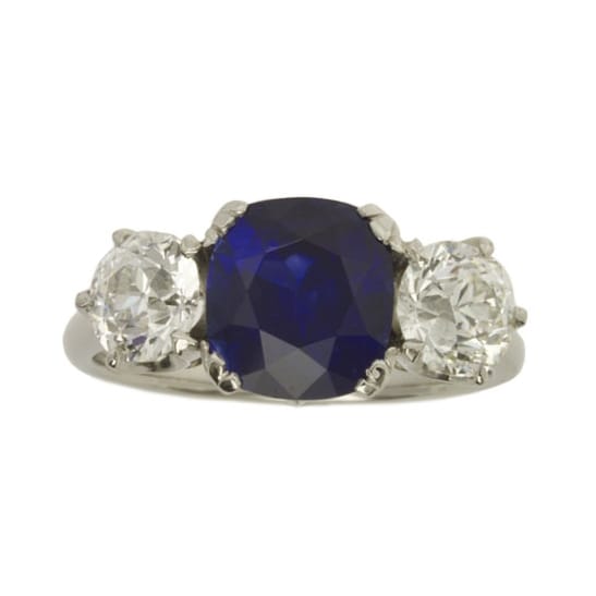 A Sapphire And Diamond Three-stone Ring