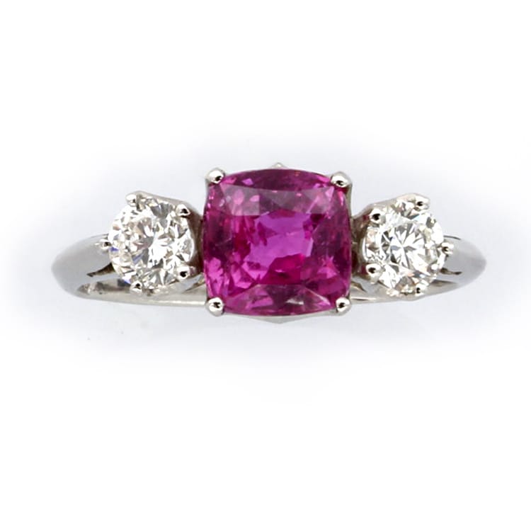 A Three Stone Pink Sapphire And Diamond Ring