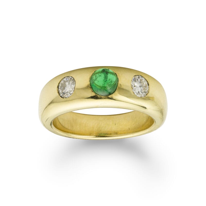 An emerald and diamond gold gypsy ring