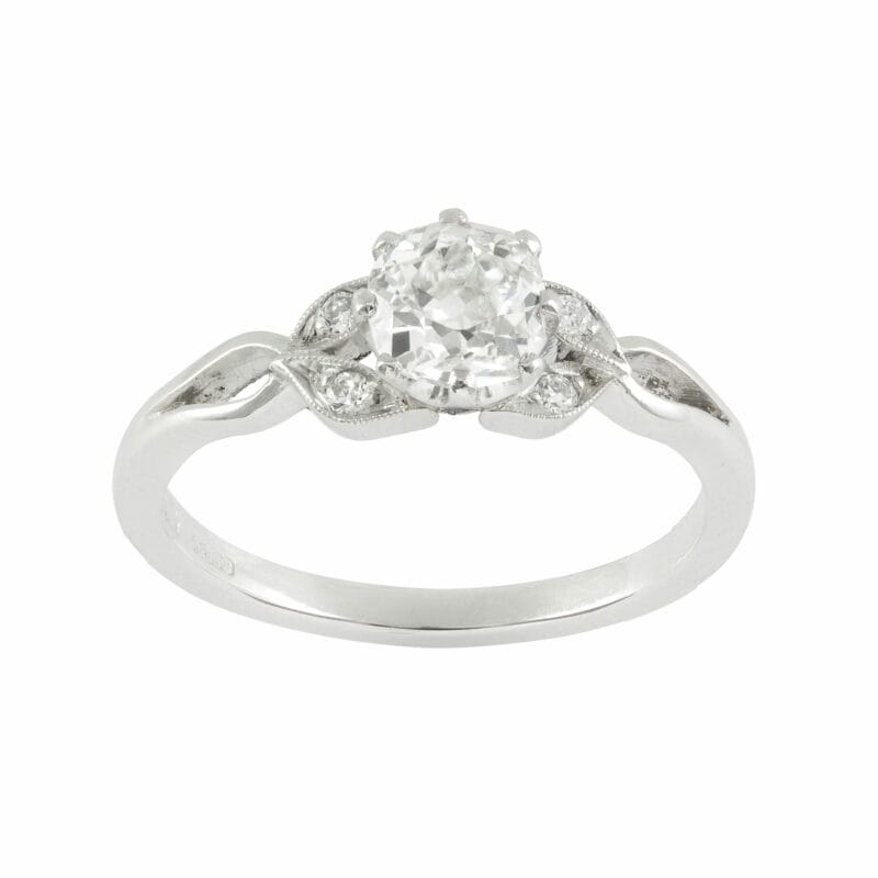 A Single Stone Diamond Ring With Leaf Shoulders