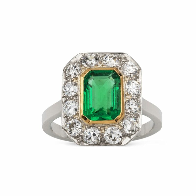 An Art Deco Emerald And Diamond Cluster Ring