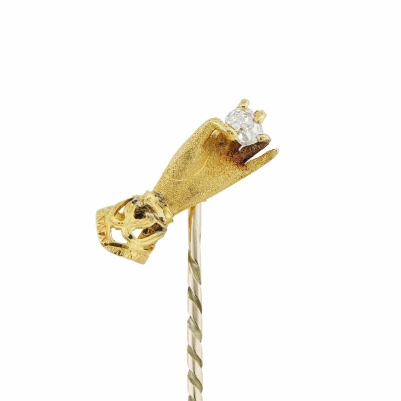 A Gold Hand And Diamond Stick-pin